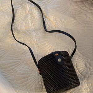 Fun rattan Black Woven Crossbody Bag. Fun lining. Conversation piece